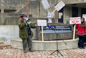 Munroe Molotov, who has been homeless and knows the importance of having your basic needs met, including washroom accessibility, speaks at Monday's rally outside St. John's City Hall. Jenna Head • Saltwire
