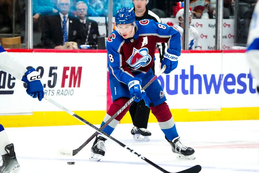 Nov 27, 2023; Denver, Colorado, USA; Colorado Avalanche defenseman Cale Makar (8) controls the puck in the second period against the Tampa Bay Lightning at Ball Arena. Mandatory Credit: Ron Chenoy-USA TODAY Sports