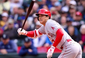 Shohei Ohtani of the Los Angeles Angels hits an RBI single during the seventh inning against the Seattle Mariners at T-Mobile Park on April 5, 2023 in Seattle, Wash. 