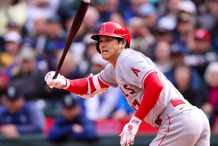 Shohei Ohtani of the Los Angeles Angels hits an RBI single during the seventh inning against the Seattle Mariners at T-Mobile Park on April 5, 2023 in Seattle, Wash. 