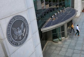 People exit the headquarters of the U.S. Securities and Exchange Commission (SEC) in Washington, D.C., U.S., May 12, 2021.