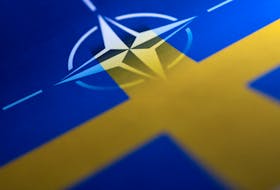 Swedish and NATO flags are seen printed on paper this illustration taken April 13, 2022.
