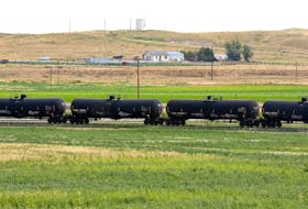 A crude oil train moves through the yard at an oil transloading facility in Ft. Laramie, Wyoming July 15, 2014..