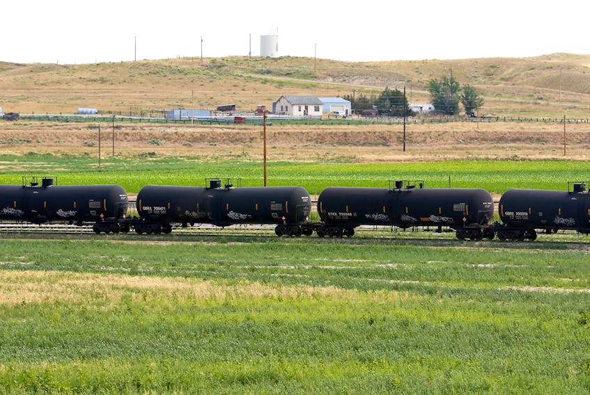 A crude oil train moves through the yard at an oil transloading facility in Ft. Laramie, Wyoming July 15, 2014..