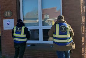 Workers with Frontline Security Solutions install security cameras at SIMCorp in St. Stephen as part of a plan to create five surveillance hubs in the community to dater petty crime and drug activity. - Frontline Security Solutions Facebook