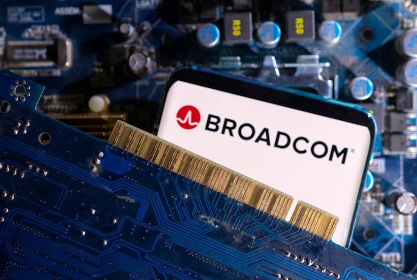 A smartphone with a displayed Broadcom logo is placed on a computer motherboard in this illustration taken March 6, 2023.