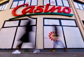 People walk past a Casino supermarket in Nice, France, January 31, 2022.