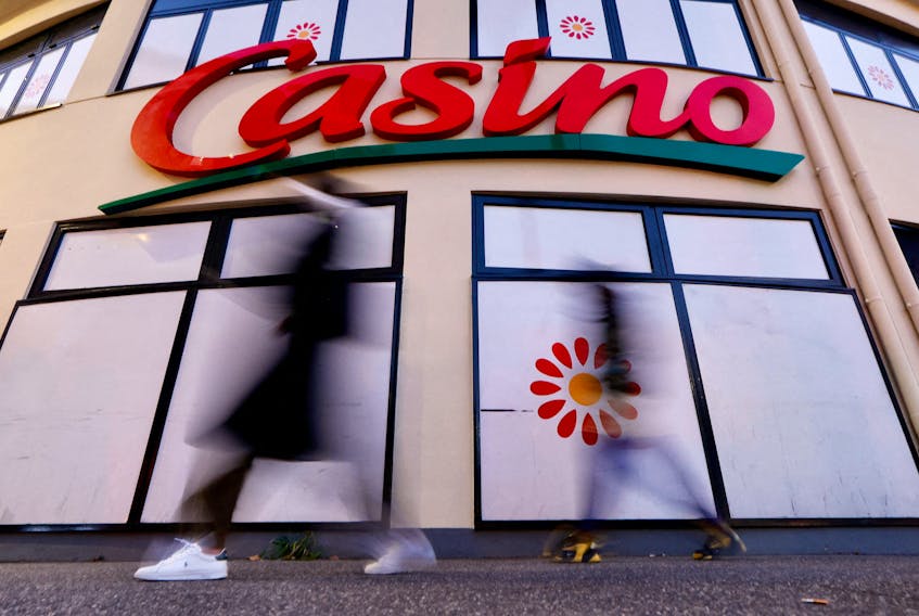 People walk past a Casino supermarket in Nice, France, January 31, 2022.