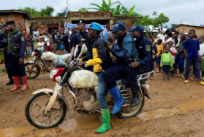 Congolese police officers secure the streets during a campaign rally of presidential candidate Moise Katumbi in Kitutu village within Mwenga territory of South Kivu province, Democratic Republic of the Congo November 24, 2023.