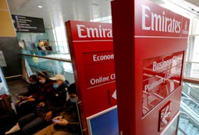 Signs for Emirates airlines are stacked to the side at Logan Airport in Boston, Massachusetts, U.S., January 19, 2022.  