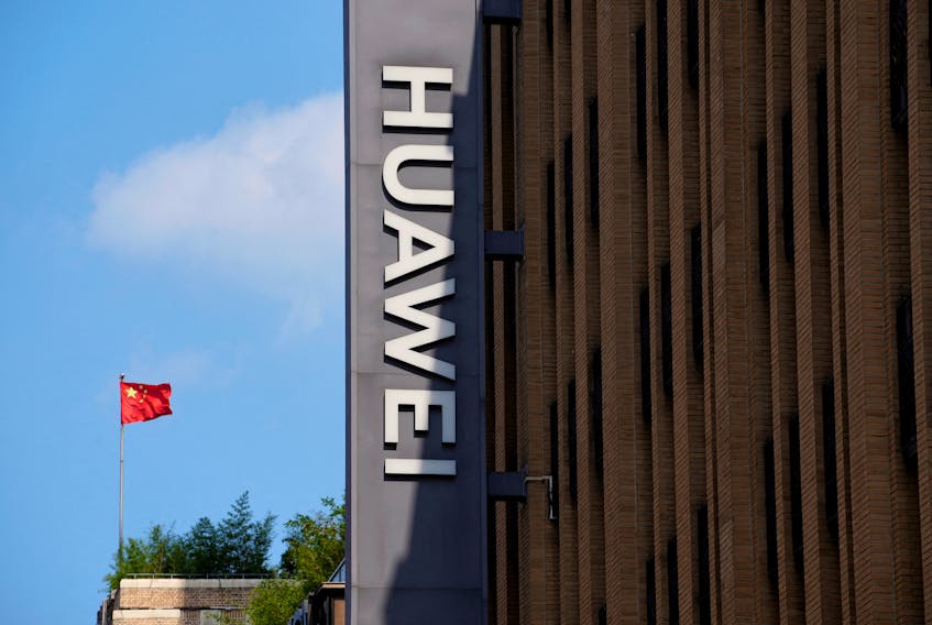 A Chinese flag flutters near a Huawei store in Shanghai, China, Sept. 8, 2023.