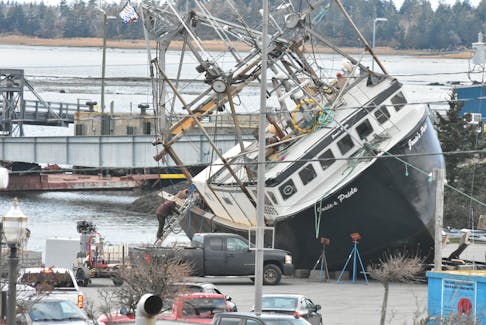 The fishing vessel Josie's Pride sat on its starboard side following a mishap on Nov. 14 at the Lobster Rock Wharf in Yarmouth. TINA COMEAU