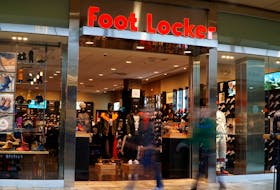 Customers walk by the Foot Locker store in Broomfield, Colorado in a slow shutter exposure November 17, 2016. 