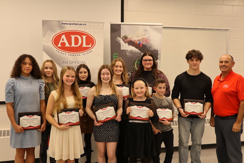 Gymnastics P.E.I. and ADL recently presented awards for the 2022-23 season in Summerside recently. Award winners were, front row, from left: Presley Dunsford, senior Xcel female athlete of the year; Chloe Cudmore, national female athlete of the year; Olivia Passmore, compulsory female athlete of the year; Matao Burden, Matthieu D’Amour Provincial Stream male athlete of the year; Jacob Martin, Scott Chandler senior male athlete of the year, and Mark MacGuigan, ADL representative. Back row: Chloe Thomson, junior Xcel athlete of the year; Nealah Court, senior provincial female athlete of the year; Anna Smith, junior provincial female athlete of the year; Dara MacInnis, women’s official of the year, and Kristi Macleod, women’s artistic gymnastics coach of the year. Contributed