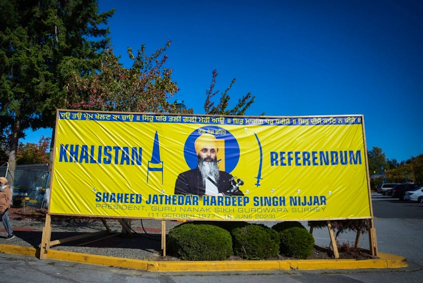 A photograph of late temple president Hardeep Singh Nijjar is seen on a banner outside the Guru Nanak Sikh Gurdwara Sahib, in Surrey, B.C., on Monday, Sept. 18, 2023.