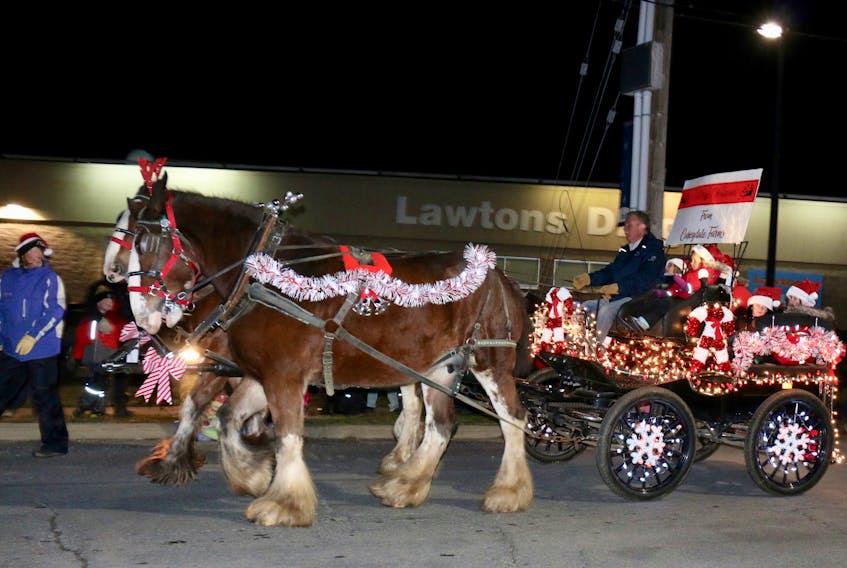 Brian Casey, of Caseydale Farms, made his way along Windsor’s streets in style for the annual Santa Parade of Lights.