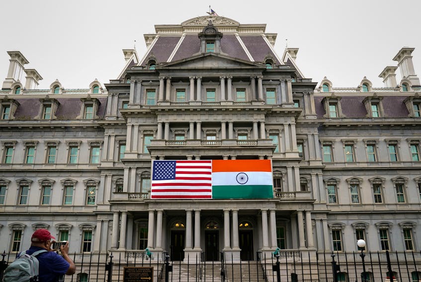 The flags of the United States and India are displayed on the Eisenhower Executive Office Building at the White House in Washington, U.S., June 21, 2023.