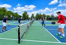 Profession pickleball player Ben Johns (2nd L), currently ranked number one in all three divisions of the sport, plays with his older brother Collin Johns (R), who is ranked number six, in Bethesda, Maryland, U.S. May 17, 2022. Picture taken May 17, 2022. 