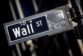 A street sign for Wall Street is seen in the financial district in New York, U.S., November 8, 2021. 