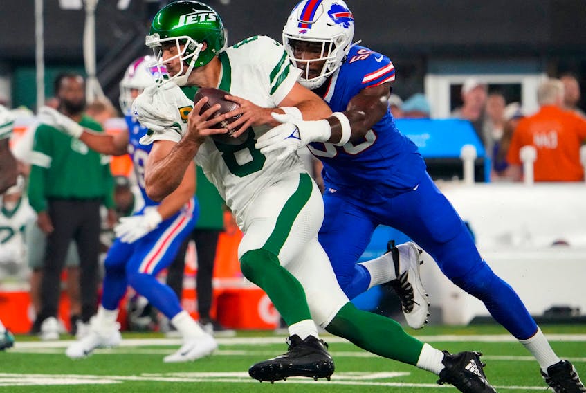 Sep 11, 2023; East Rutherford, New Jersey, USA; Buffalo Bills defensive end Leonard Floyd (56) sacks New York Jets quarterback Aaron Rodgers (8) during the first quarter at MetLife Stadium. Rogers left the game with an injury after the play. Mandatory Credit: Robert Deutsch-USA TODAY Sports/File Photo