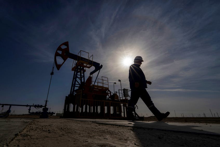 An oil and gas industry worker walks during operations of a drilling rig at Zhetybay field in the Mangystau region, Kazakhstan, November 13, 2023.