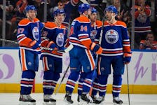 The Edmonton Oilers celebrate Mattias Janmark's (13) goal against the Vegas Golden Knights on Tuesday, Nov. 28, 2023, in Edmonton. 