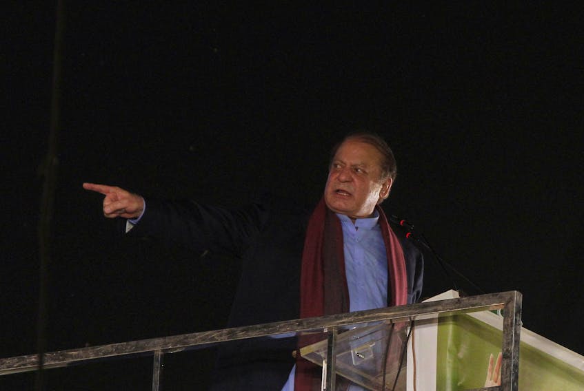 Pakistan's former Prime Minister Nawaz Sharif addresses supporters upon his arrival from a self-imposed exile in London, ahead of the 2024 Pakistani general election, in Lahore, Pakistan October 21, 2023.