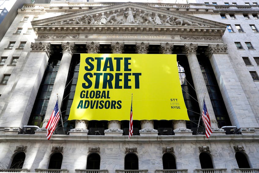 A State Street Global Advisors banner is hung outside the New York Stock Exchange (NYSE) in New York, U.S., March 8, 2021. 