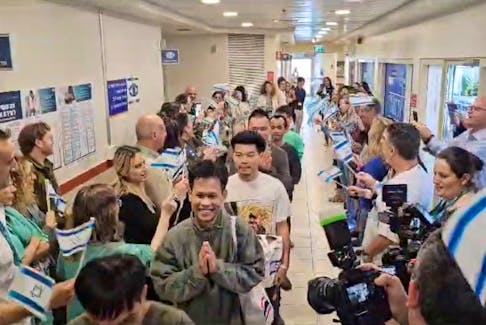 Thai citizens who were released from the Gaza Strip after being taken hostage by the Palestinian Islamist militant group Hamas during the deadly October 7 attack on Israel, attend a leaving ceremony after being discharged from Shamir Medical Center (Assaf Harofeh), in Be'er Ya'akov, Israel November 29, 2023, in this still image obtained from a video. Shamir/Handout via REUTERS