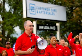 Shawn Fain, president of the United Auto Workers (UAW) speaks as U.S. President Joe Biden (not pictured) joins striking members of the United Auto Workers (UAW) on the picket line outside GM's Willow Run Distribution Center, in Belleville, Wayne County, Michigan, U.S., September 26, 2023.