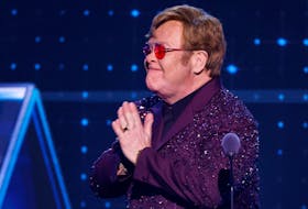 Elton John reacts as he presents the Musical Excellence Award for Bernie Taupin during the 38th Annual Rock & Roll Hall of Fame Induction Ceremony in Brooklyn, New York, U.S., November 3, 2023.