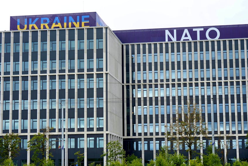 Ukraine and NATO signs are seen on a building in Vilnius, Lithuania July 10, 2023.