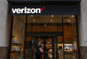 A person walks by a Verizon store in Manhattan, New York City, U.S., November 22, 2021.