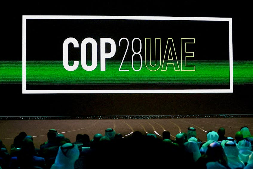 'Cop28 UAE' logo is displayed on the screen during the opening ceremony of Abu Dhabi Sustainability Week (ADSW) under the theme of 'United on Climate Action Toward COP28', in Abu Dhabi, UAE, January 16, 2023.