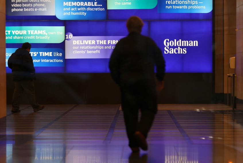 People walk in the Goldman Sachs global headquarters in Manhattan, New York, U.S., November 15, 2021.