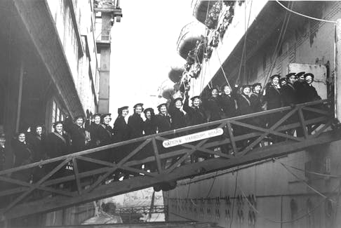 The first draft of the Women’s Royal Canadian Naval Service [W.R.C.N.S.], commanded by Isabelle McNeil, board their ship for overseas at Pier 21, August 1943. Nova Scotia Archives.