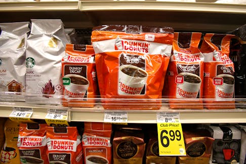 Dunkin' Donuts coffee packs are pictured alongside other coffee brands on the shelves of a grocery store in Pasadena, California July 25, 2013.