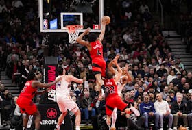 Scottie Barnes #4 of the Toronto Raptors blocks a shot by Eric Gordon #23 of the Phoenix Suns during second half action at the Scotiabank Arena on November 29, 2023 in Toronto. 
