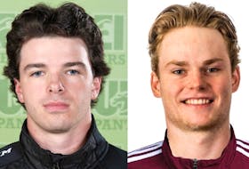 Prince Edward Islanders Landon Clow, left, and Thomas Casey, right, score in the Atlantic University Sport men's hockey contest