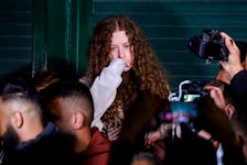 Palestinian Ahed Tamimi looks on after being released amid a hostages-prisoners swap deal between Hamas and Israel, in Ramallah, in the Israeli-occupied West Bank, November 30, 2023.