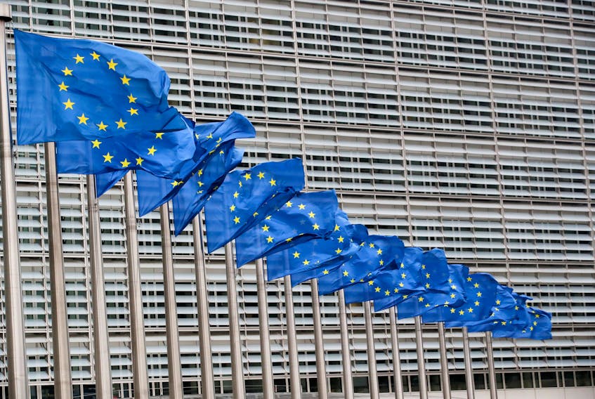 European Union flags flutter outside the EU Commission headquarters in Brussels, Belgium, July 14, 2021.