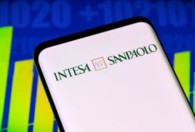 Intesa Sanpaolo bank logo and stock graph are seen displayed in this illustration taken, May 3, 2022.