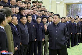 North Korea's leader Kim Jong-un meets with members of the Non-Standing Satellite Launch Preparation Committee, in this picture released by the Korean Central News Agency on November 24, 2023. KCNA via