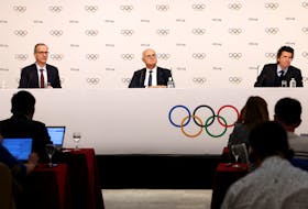 Olympics - IOC Executive Board meeting press conference - Salon Hoche, Paris, France - November 29, 2023 Director of Communications for International Olympic Committee Mark Adams, President of the Austrian Olympic Committee Karl Stoss and Olympic Games Executive Director Christophe Dubi during the press conference