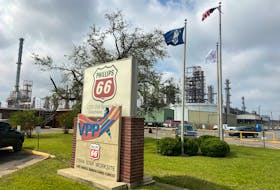 Flags wave in front of the Phillips 66 refinery near Lake Charles, Louisiana, U.S. October 11, 2020.