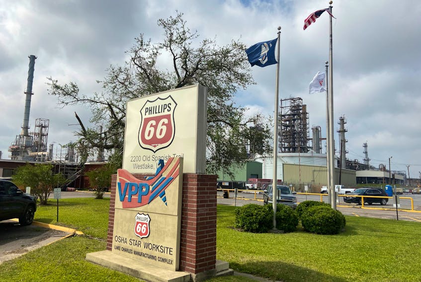 Flags wave in front of the Phillips 66 refinery near Lake Charles, Louisiana, U.S. October 11, 2020.