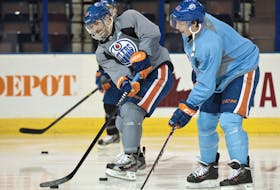 Edmonton Oilers forwards Sam Gagner (89) and Ryan Nugent-Hopkins (93) take part in practice at Rexall Place in Edmonton in this file photo taken on Nov. 14, 2013.