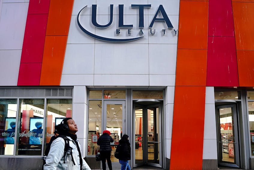People walk past an Ulta Beauty store in the Manhattan borough of New York City, New York, U.S., March 8, 2022. 