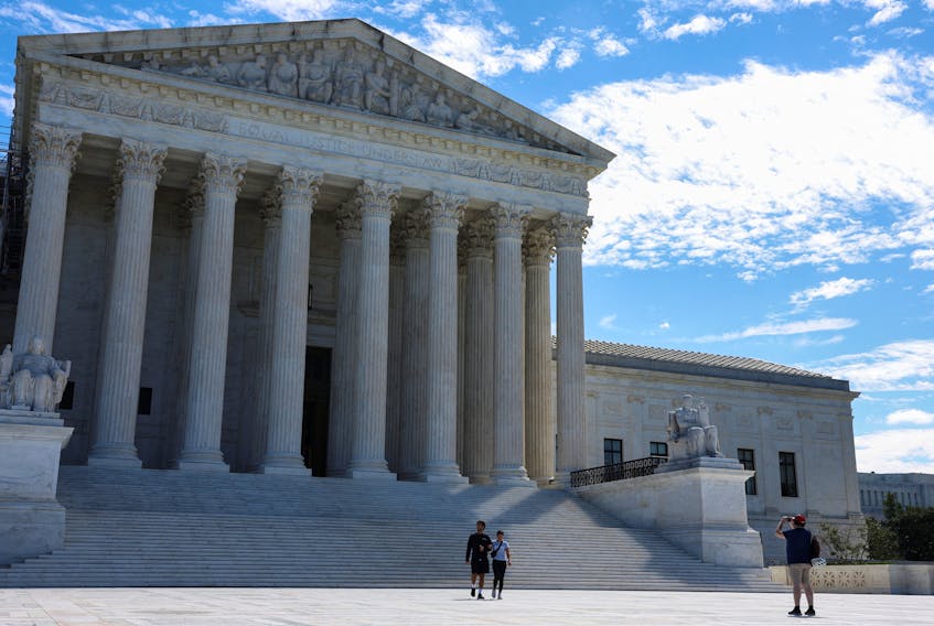 People visit the U.S. Supreme Court building on the day that Justices Clarence Thomas and Samuel Alito released their delayed financial disclosure reports and the reports were made public in Washington, U.S., August 31, 2023.