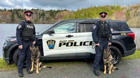 Const. Mike Jackson, left, with Maverick and Const. Scott Boyles with Arlo are the latest K9 unit members with the Saint John Police. - Contributed